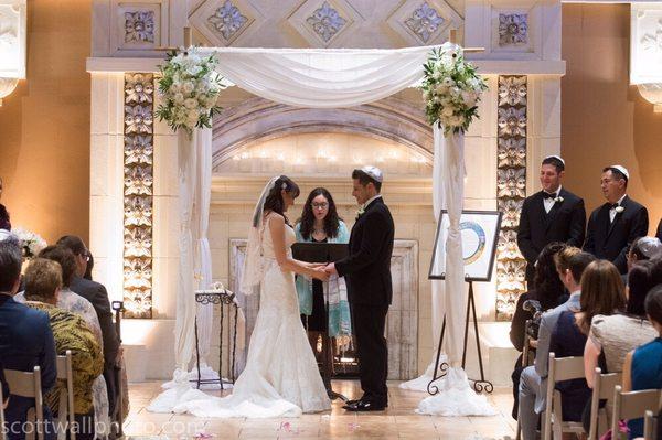 Bamboo chuppah with drapes.