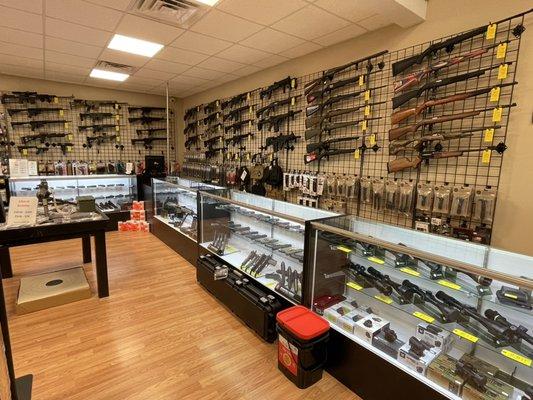 Full display of tactical, hunting, and sporting rifles and shotguns.