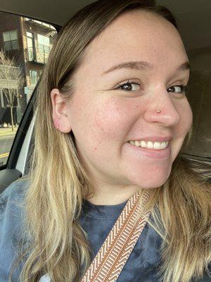 Nose piercing and gold hoop placement