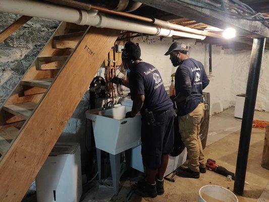 Building a sink in the basement, and a pump system to get the water from the sink and laundry up to the sewer level