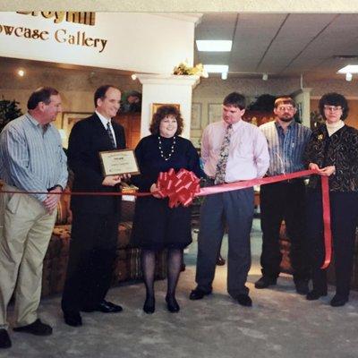 An older photo of a ribbon cutting of one of our many additions over the years.