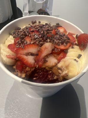 Vitality bowl + granola to bottom +  peanutbutter to top + cacoa nibs