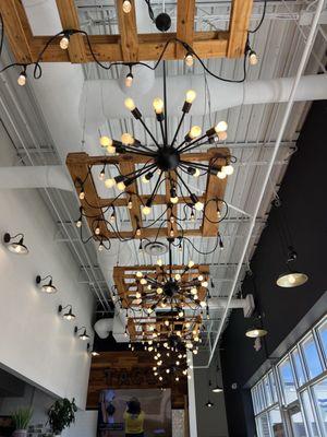 Love the wooden pallet light fixtures!