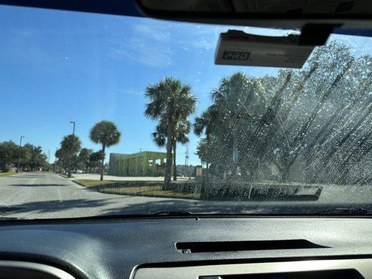 Hard water left streaks and spots on the windshield.