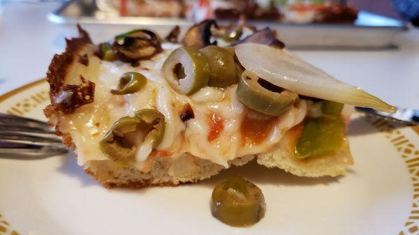 Side view of Veggie Lover's pizza ($20+$3 for vegan cheese). Great crust. Good texture & flavor from Glenview Farms vegan cheese.