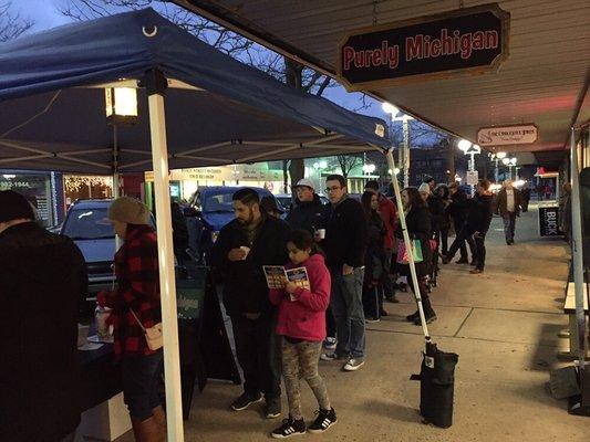 Line stretching outdoors for the annual chili fest.