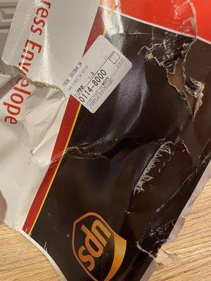 Heavily damaged UPS envelope