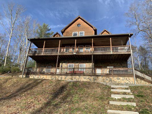 Such a stunning home. Picture taken at fire pit area. Comfortable Adirondack chairs.