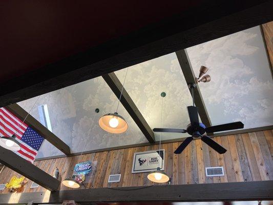 The local pizza place where I came from had clouds on the ceiling too. I like it.