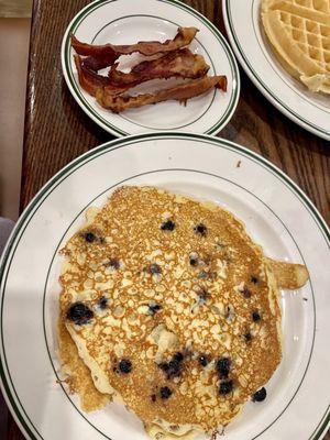 Short stack blueberry pancakes with side of bacon