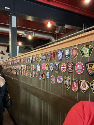 Small display of the Police and Fire Department patches