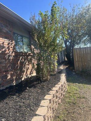 See how a raised bed with retaining wall can elevate your home's look.