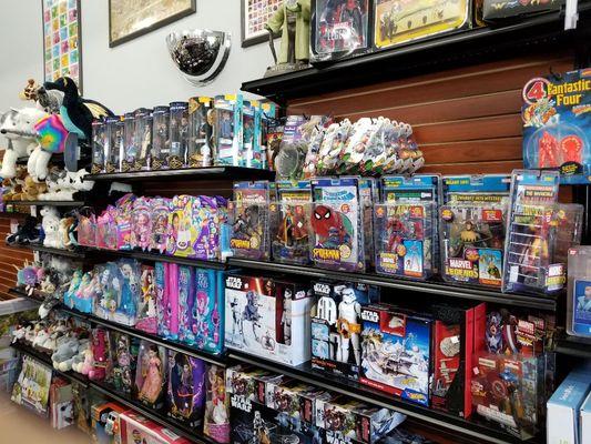 Over 20 foot section of new and Vintage toys