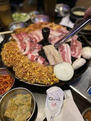 Pork belly and brisket with kimchi, bean sprout, onions and mushroom