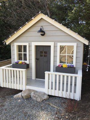 After adding electrical and painting the playhouse.