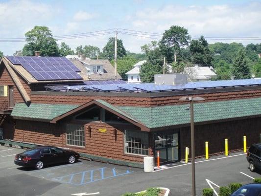 Varmax Liquor Pantry from the parking lot, featuring solar panels.