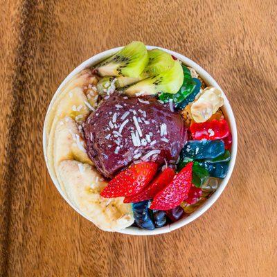 Açaí bowl with fruit toppings and gummy bear