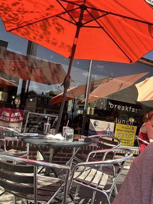 Outdoor seating under large umbrellas.