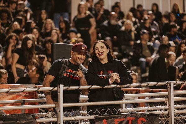 MV parents supporting their student and team at a football game