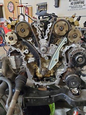 Ford water pump replacement with revised pump and new chains, tensioner's and guides.