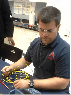 Student working in the fiber optics laboratory.