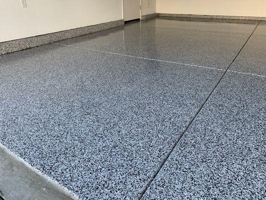 Granite speckled epoxy garage floor by Victor Schuh of Custom Garage Storage Solutions of Lodi CA.