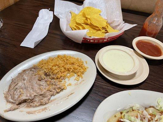 Rice and refried beans and Chips and Queso