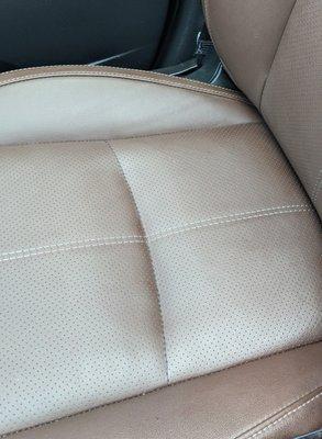 Front seat, with sand in the seat holes, and all along the stitching