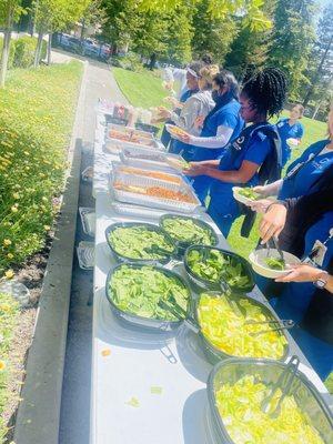 Lunch is served! Hard working students take a break to enjoy a delicious bite.