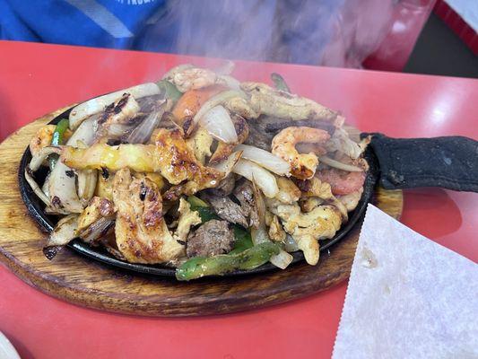 Camarón  chicken  y steak  fajita it was good and sizzling you can see it in the picture.