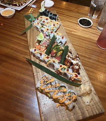 Sushi - bottom to top; amazing!   * American * Spicy Tuna * Dressed Sushi Trio * Spicy Tuna * Spicy Scallop * Avocado and Cucumber Roll