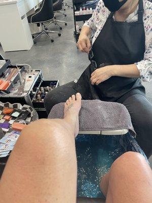 Jessica working her magic on my tired feet.   Many diff options for pedicures. I went for the one with the longest massage time.