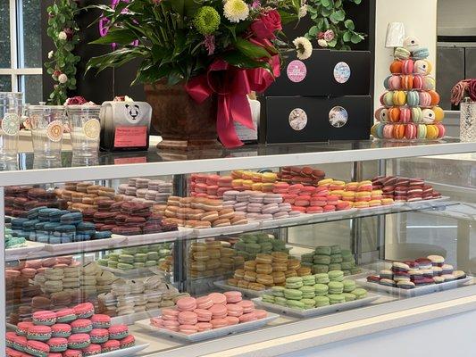 Full pastry case of fresh macarons