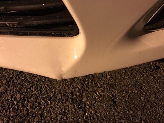 Front bumper spoiler damage from Ramsay towing driver.