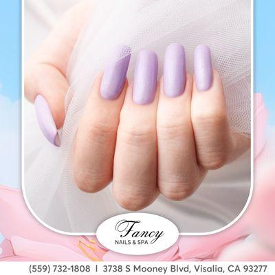 Indulge in the regal allure of purple with our exquisite nail designs at Fancy Nails Salon!  #PurplePassion #NailRoyalty"