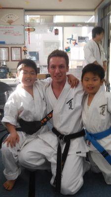 Sensei Shane photo with children students from HQ Dojo in Japan.