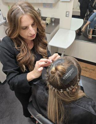 Extensions can give you immediate length while learning about scalp care that can grow your hair naturally