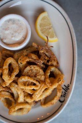 Fried calamari with lemon wedge and aioli at The Carlile in Downtown Seattle