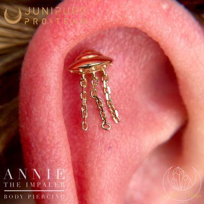 Fresh flat piercing with solid gold UFO by Annie the Impaler at Crystal Moon Body Arts