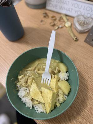 Yellow curry with onions chicken tofu and potatoes