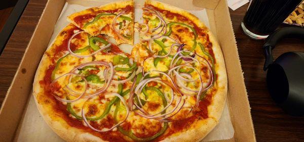 Small pizza with green peppers and red onions.  Nice thin slices, rings.