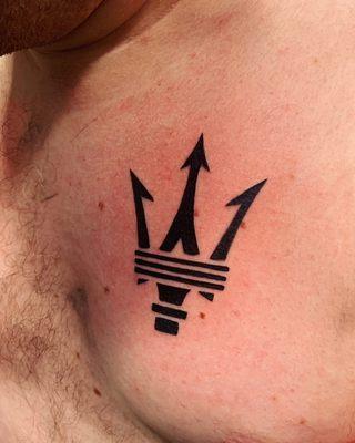 Chest piece of a Maserati logo done by Nick W.