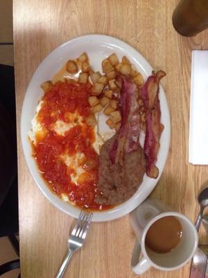 Huevos Rancheros with potatoes and refried beans.