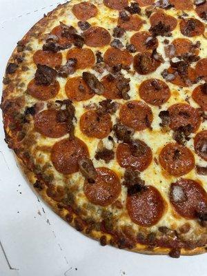 Crumbled Sausage, Pepperoni, and Bacon Pizza