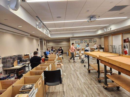 volunteers sorting books for the September book sale