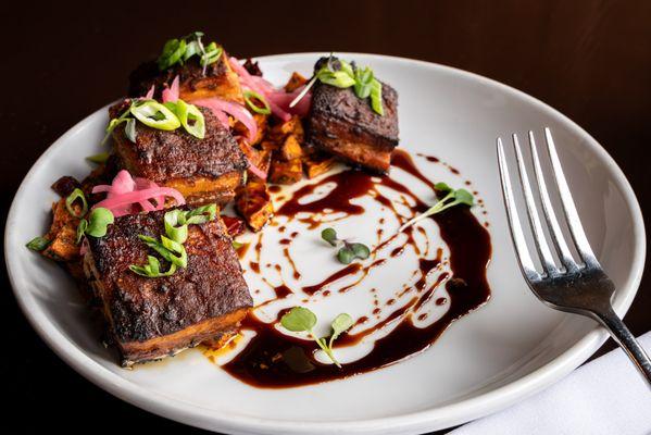 Pork Belly - Roasted pork belly, sweet potato hash, pickled red onions, sweet soy glaze, scallions