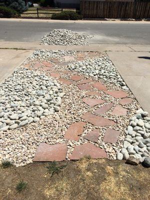 Small rock landscape with sandstone path, we designed for side of driveway where grass was dead.