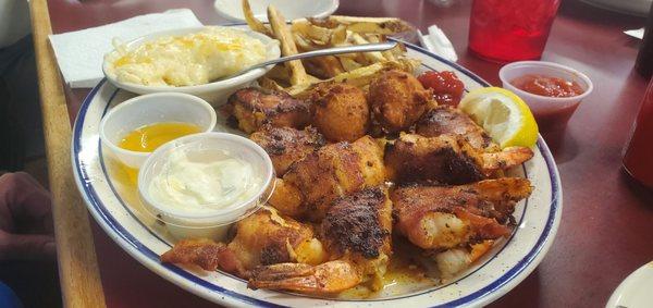 Bacon Wrapped Stuffed Shrimp (w/Fries, cheese grits & hushpuppies)