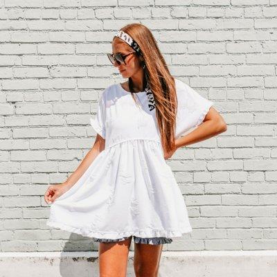 This white dress is actually a tunic but if you size up it becomes a dress. Available in all sizes online under the name Amelia Tunic.