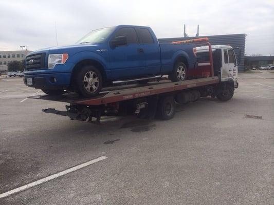 This flatbed hauler, escorts your vehicle with much more care than a typical tow truck